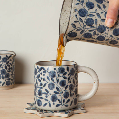 Danica Studio Calendula Element Mug in a styled setting — stoneware